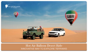 Hot air balloon desert ride floating over the golden dunes at sunrise in Dubai.