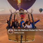 Family enjoying a peaceful hot air balloon ride over the Dubai desert at sunrise.