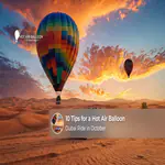 A hot air balloon floating above the Dubai desert during a peaceful October sunrise.