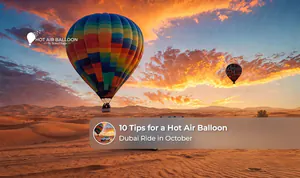 A hot air balloon floating above the Dubai desert during a peaceful October sunrise.