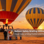 Dubai hot air balloon safety briefing using visual hand signals, landing position demonstrations and crew guidance for non-English-speaking passengers