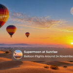 Dubai hot air balloon at sunrise over the desert during the November 2026 supermoon period